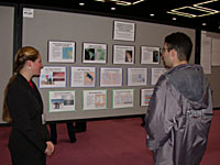 Mario looks at Maura's poster