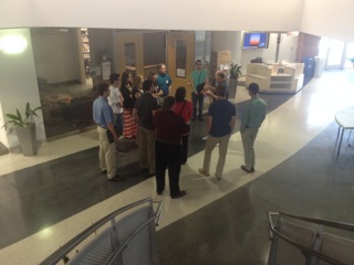 Group huddled on the first floor to start their tour of the NWC